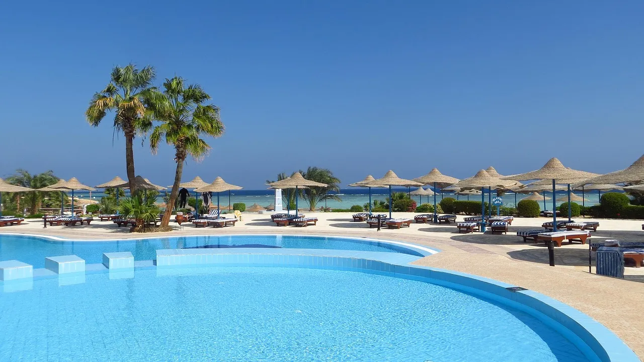 Resorts Places to Tan" Crossword Clue